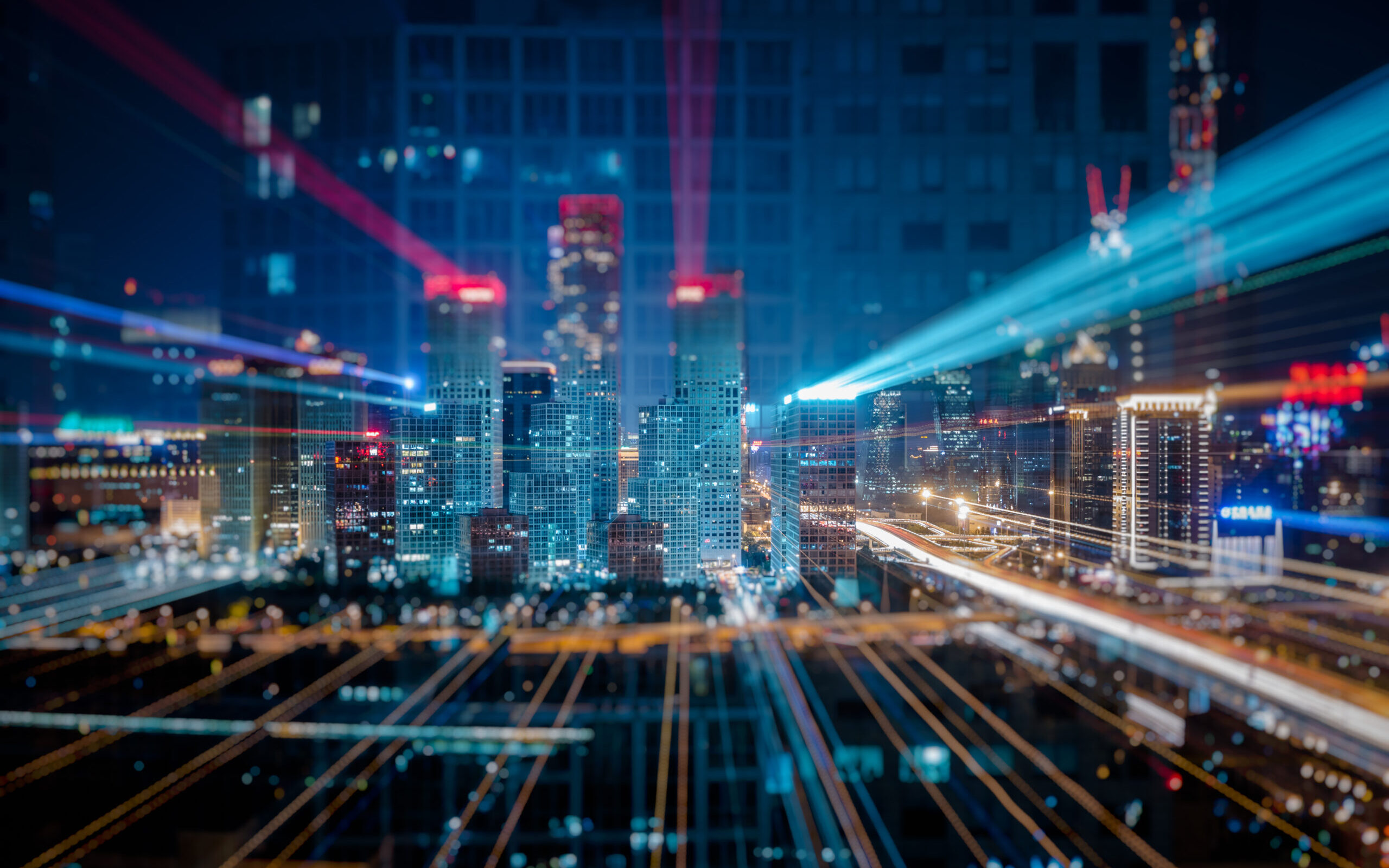 Light trails above buildings at night in China.